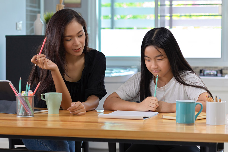 student and tutor together at a desk in Canton